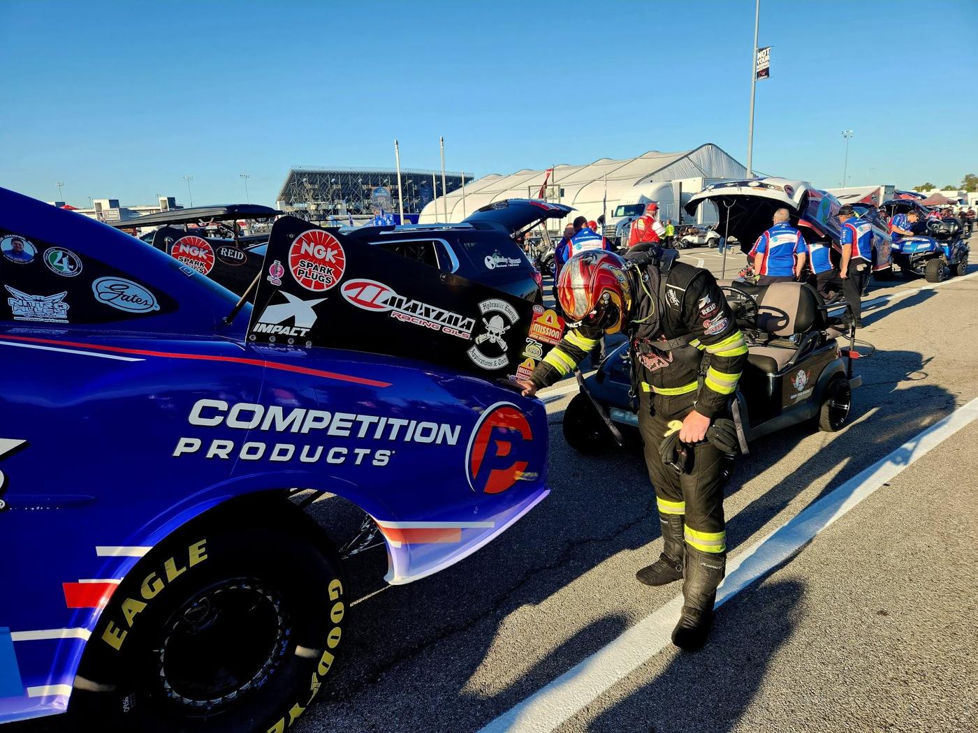 Suited up beside the car, Chris King's #343