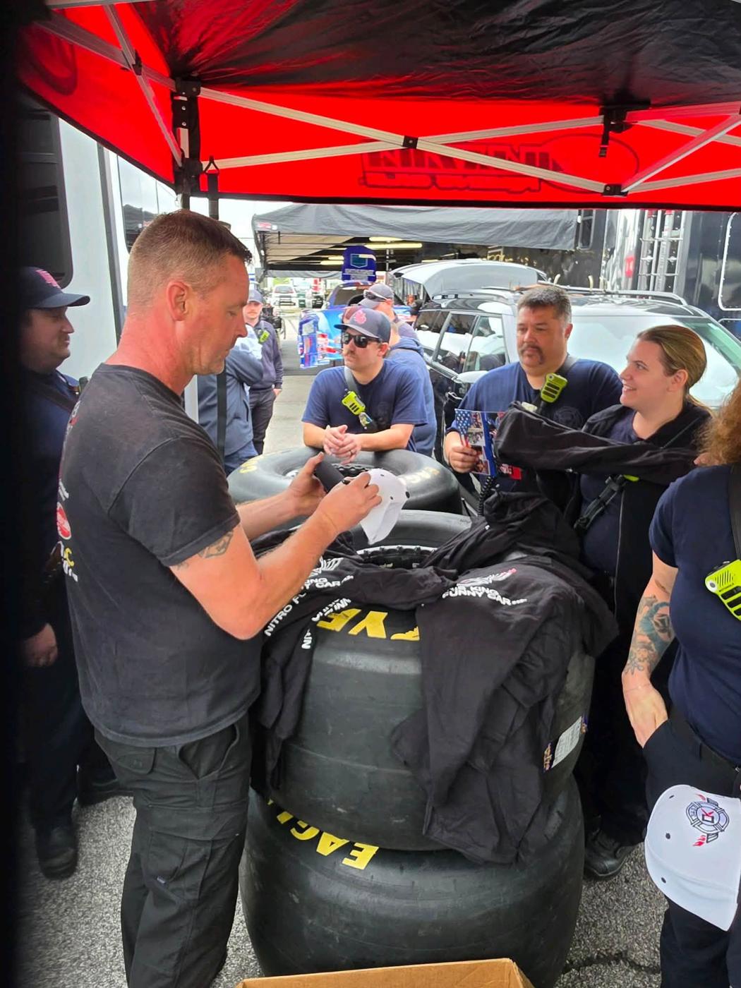 Signing hats for the visitors, Chris King's #343